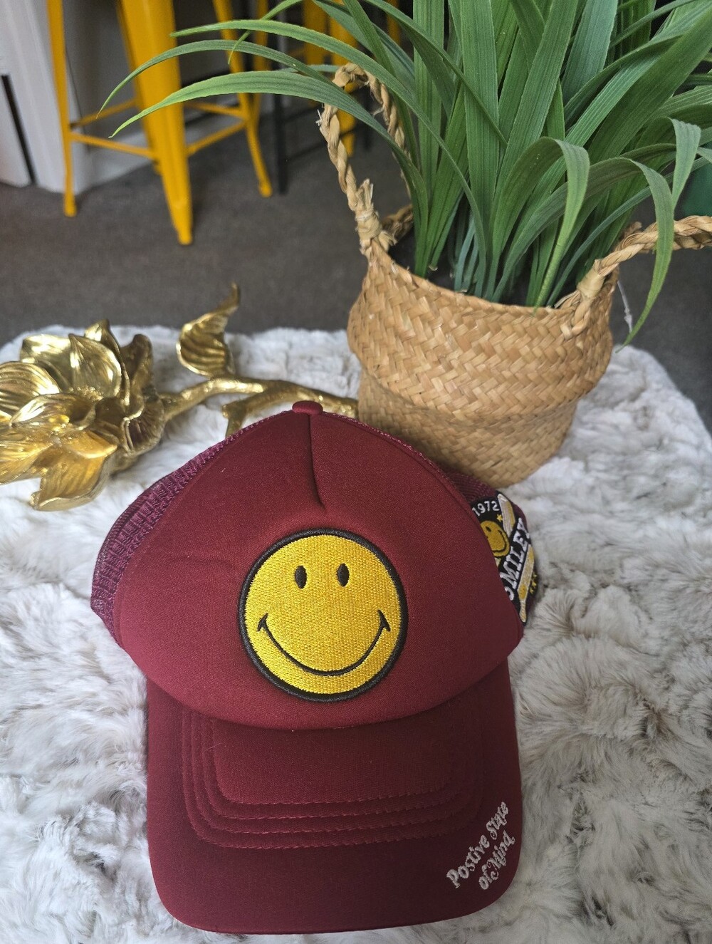 Burgundy Trucker Hat with Yellow Smiley Patch